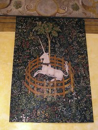 Cover up ceiling blemishes while transforming a room at the same time with a tapestry.