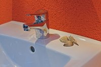 You can build a cabinet for a laundry sink youself.