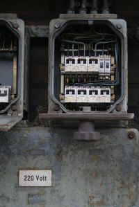 A circuit breaker will trip if a power surge exceeds its capacity.