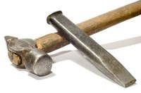 A hammer and chisel is option for breakign up hard magnets.