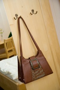 Coat hooks are perfect for hanging handbags.