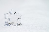 Sprinkle fake snow around your miniature Christmas village.