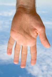 Ringworm is commonly spread from one person to another by touching or sharing personal items such as towels, bath mats and makeup.