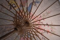 A parasol can be transformed into a hanging light fixture.