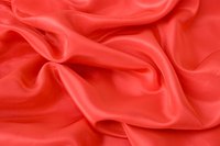 Satin fabric is sometimes woven with polyester threads.