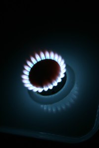 A black stove shows water spots.