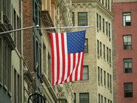 A homemade flagpole bracket can make it easier to display flags.