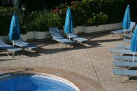 Tile adds an attractive feature to fiberglass pools.