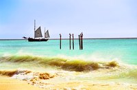 Waves roll in at an Aruba beach.