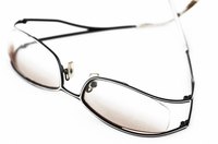 Optometrists prescribe corrective lenses to patients.