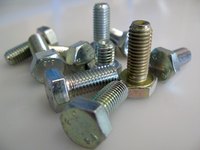 The threads on bolts are made with a die while taps make the threaded holes they go into.