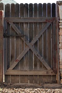 Make your wood gate twice as wide to accommodate large machinery.