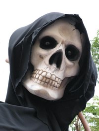 Move the jaw on a skull mask to say "Trick or Treat."