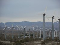 Windmill farms require little maintenance and are often tourist attractions.