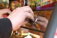 Slot machines charge a small amount for a slim chance of winning a large reward.