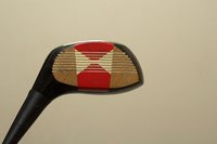 Celebrate the beauty of golf clubs by featuring them in home design.