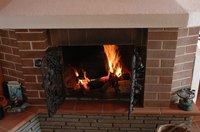 Remove dirt, soot and debris from your fireplace mantel with routine cleaning.