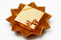 Present a child's golden birthday gift in a gold gift box.