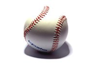 Baseballs make fun bedpost finials for a sports-themed room.