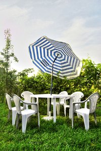 Protect a vinyl umbrella from the elements with a vinyl sealer.