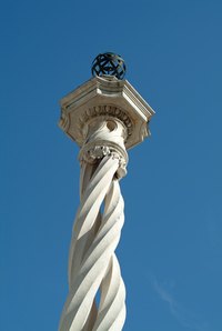 A edieval cement column inspires wedding decorations.