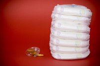 Using disposable diapers is the easiest and cheapest way to make a diaper cake.