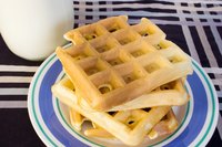 Prepare waffles for breakfast with a cast iron waffle maker.
