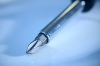 A screwdriver is the one tool required to remove most medicine cabinets.