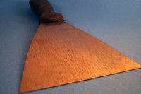 Adhesive remnants must be removed from the subfloor before laying new tile.