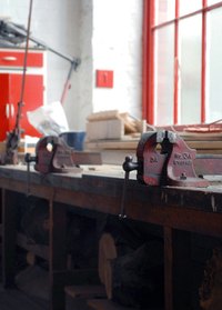 A cluttered garage space can improve with well-planned cabinets.