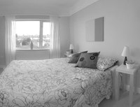 This bed covering that almost touches the floor is a bedspread.