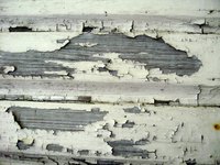Remove peeling paint by sanding, scraping or scouring wood.