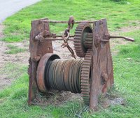 An old stationary winch where the body of the machine serves as the nonmovable object.