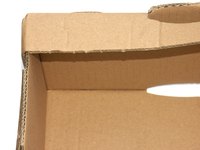 Cellulose insulation is prepared from shredded cardboard boxes and newspapers.
