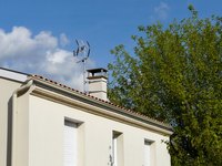 Gutters will end where the roof no longer slopes downward.