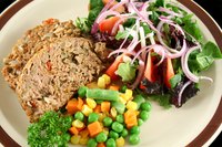 Meatloaf contains fat, which usually keeps it from sticking to the pan.