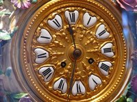 Clock hands and the hand nut.