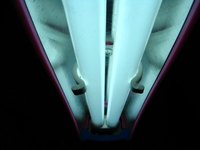 Acrylic light diffuser panels soften the light emitted from a fluorescent light.