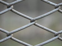 Chain link makes a sturdy makeshift dog pen.