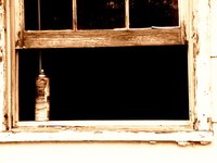 The cracked glazing compound around these window panes needs to be replaced with new, pliable glazing compound.