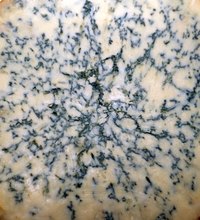 Stilton cheese bears a resemblance to its blue cheese relation.