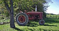 Hitching a plow to a Farmall Super A is less laborious than with many other tractors.
