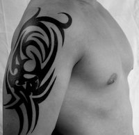 Complex designs, such as tribal tattoos, require the use of a stencil.
