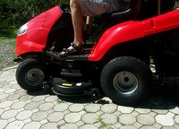 Most riding lawn mower wheels utilize snap rings and flat washers for retention.