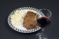Grill a medium ribeye steak to create a simple and quick meal.