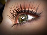 Fake eyelashes add drama.