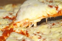 Grease and burnt crust must be removed from pizza pans.