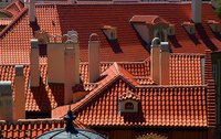 Cut roof tiles are crucial for coverage of buildings containing multiple peaks and valleys.