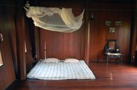 Adding a mosquito net canopy can spice up any room.