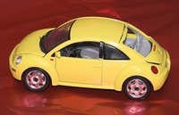 Give a miniature car first as a creative way to present the big gift.